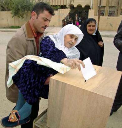 Woman being carried so she could cast her vote.