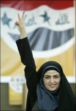 Woman proudly giving the v sign with her inked finger after voting.